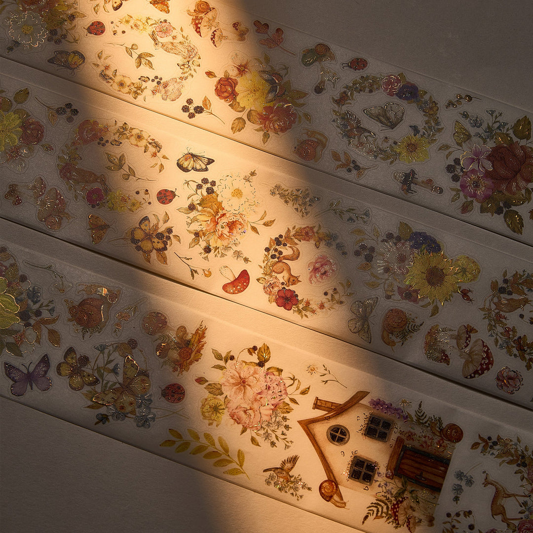 The Washi Tape Shop Golden Harvest Wide Washi/PET Tape laid out in warm sunlight, showing the seashell gilded golden florals