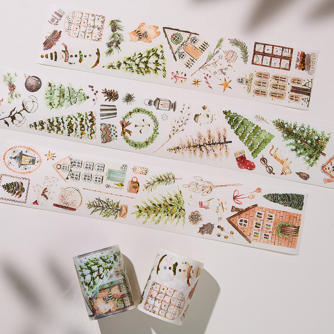 Strips of The Washi Tape Shop Holiday Hamlet Wide Washi/PET Tape laid flat with the rolls, showing the full design