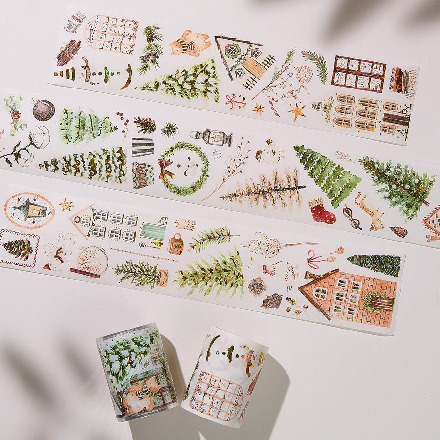 Strips of The Washi Tape Shop Holiday Hamlet Wide Washi/PET Tape laid flat with the rolls, showing the full design