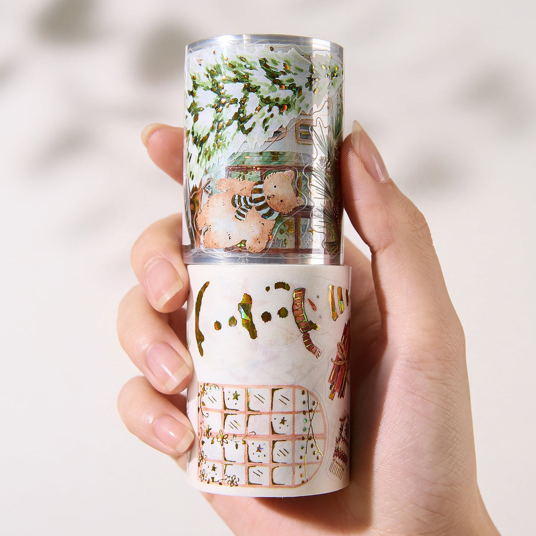 Hand holding the washi and PET rolls of The Washi Tape Shop Holiday Hamlet Wide Washi/PET Tape