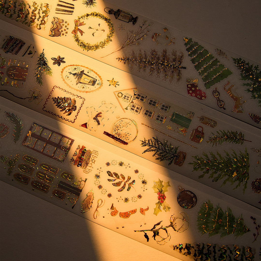 The Washi Tape Shop Holiday Hamlet Wide Washi/PET Tape laid out in warm sunlight, showing the seashell gilded winter cottages
