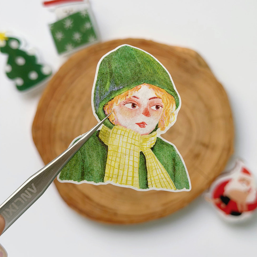Tweezers lifting a pre-cut piece from The Washi Tape Shop Holly Belle Wide Washi/PET Tape