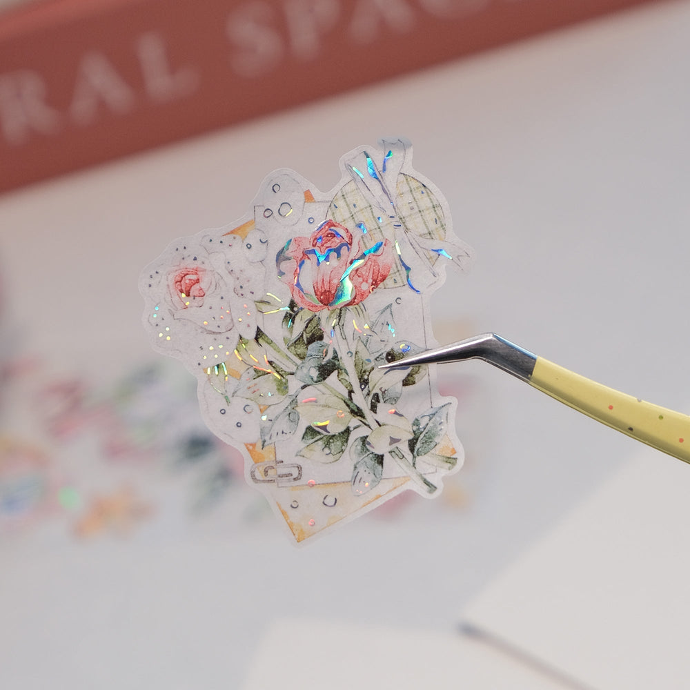 Peeling a pre-cut piece from The Washi Tape Shop Holly Bloom Wide Washi/PET Tape onto a journal page