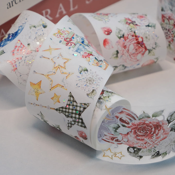 Strips of The Washi Tape Shop Holly Bloom Wide Washi/PET Tape beside the washi and PET rolls