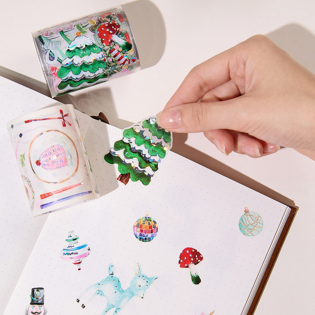Peeling a pre-cut piece from The Washi Tape Shop Pink Frost Wide Washi/PET Tape onto a journal page