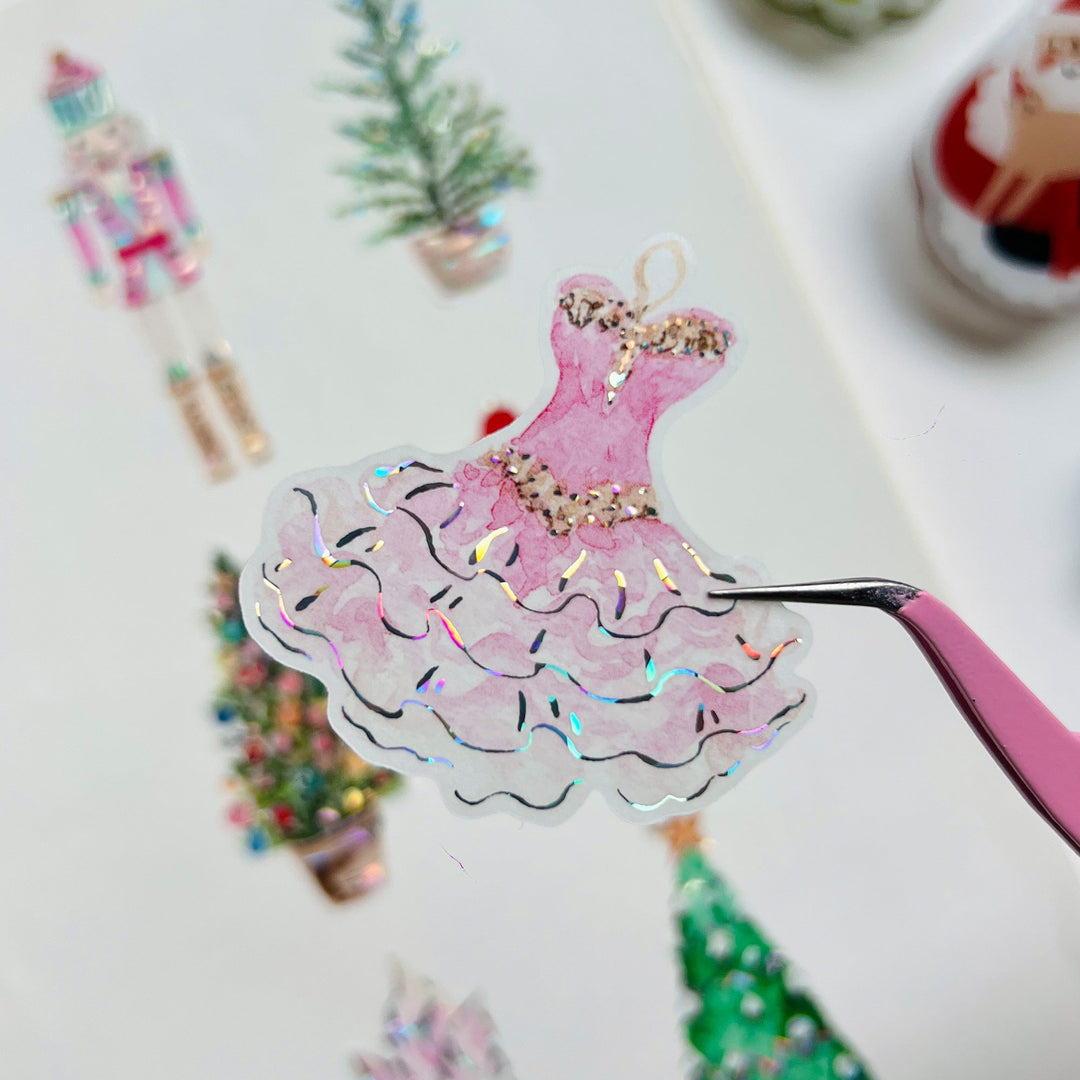 Tweezers lifting a pre-cut piece from The Washi Tape Shop Pink Frost Wide Washi/PET Tape