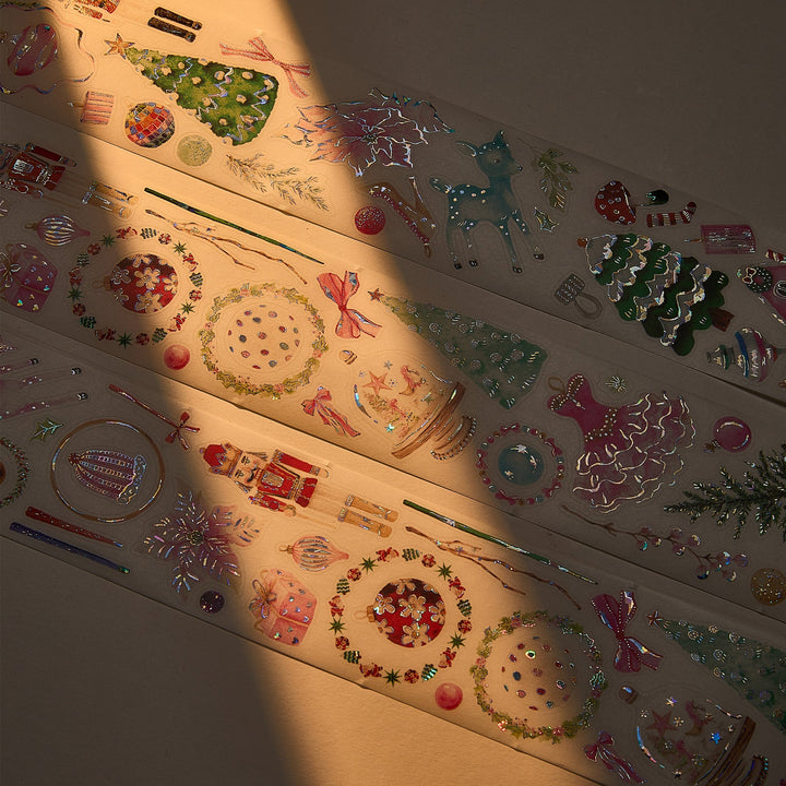 The Washi Tape Shop Pink Frost Wide Washi/PET Tape laid out in warm sunlight, showing the seashell gilded gingerbread cottages