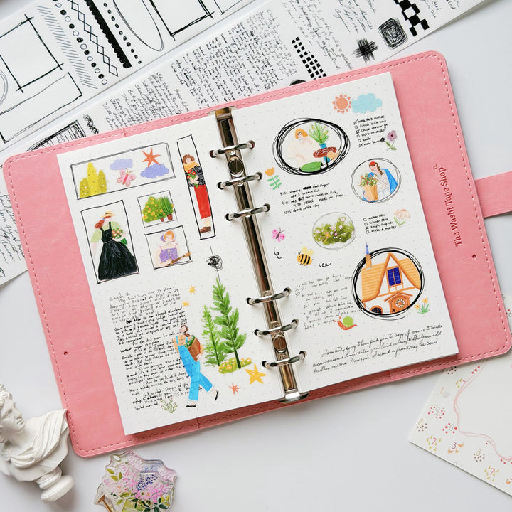 Hand holding the washi and PET rolls of The Washi Tape Shop Scribbled Thoughts Wide Washi/PET Tape