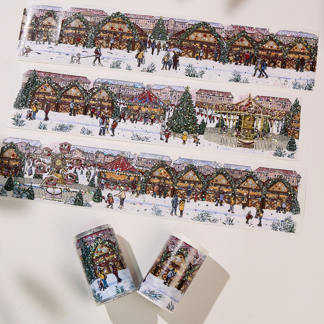 Strips of The Washi Tape Shop Yuletide Glow Wide Washi/PET Tape laid flat with the rolls, showing the full design