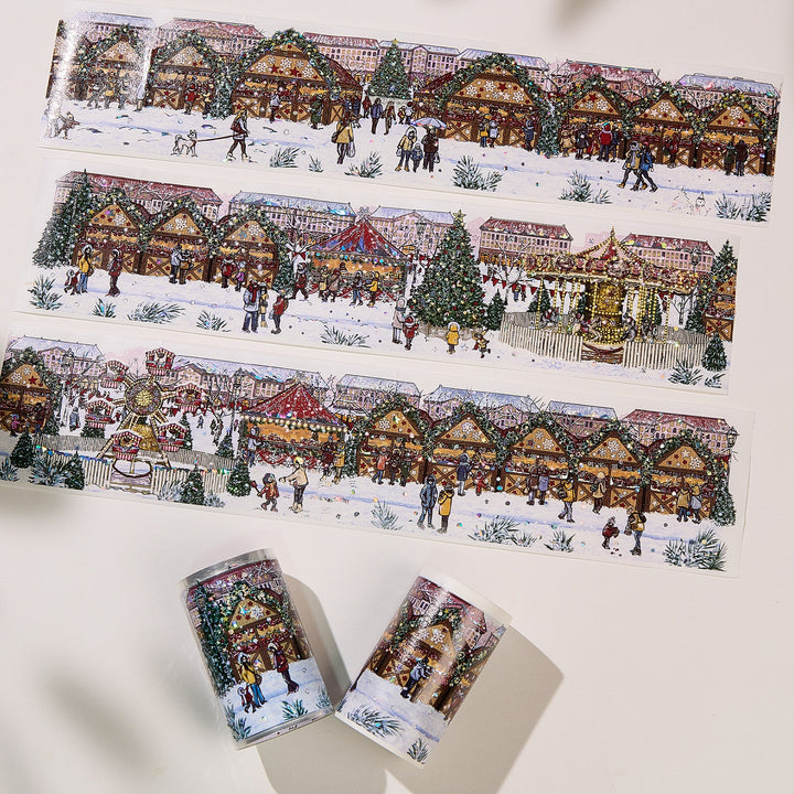 Strips of The Washi Tape Shop Yuletide Glow Wide Washi/PET Tape laid flat with the rolls, showing the full design