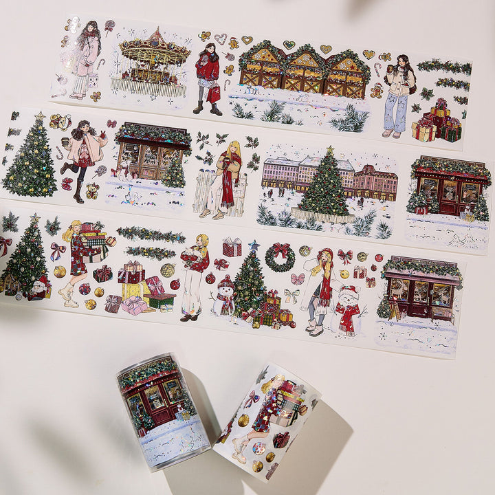 Strips of The Washi Tape Shop Yuletide Village Wide Washi/PET Tape laid flat with the rolls, showing the full design
