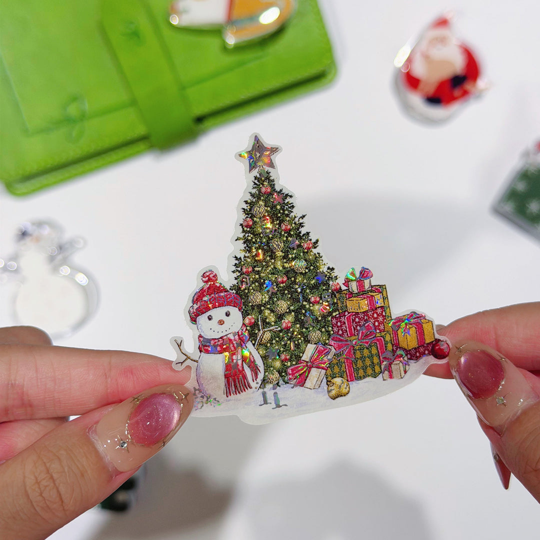 Tweezers lifting a pre-cut piece from The Washi Tape Shop Yuletide Village Wide Washi/PET Tape