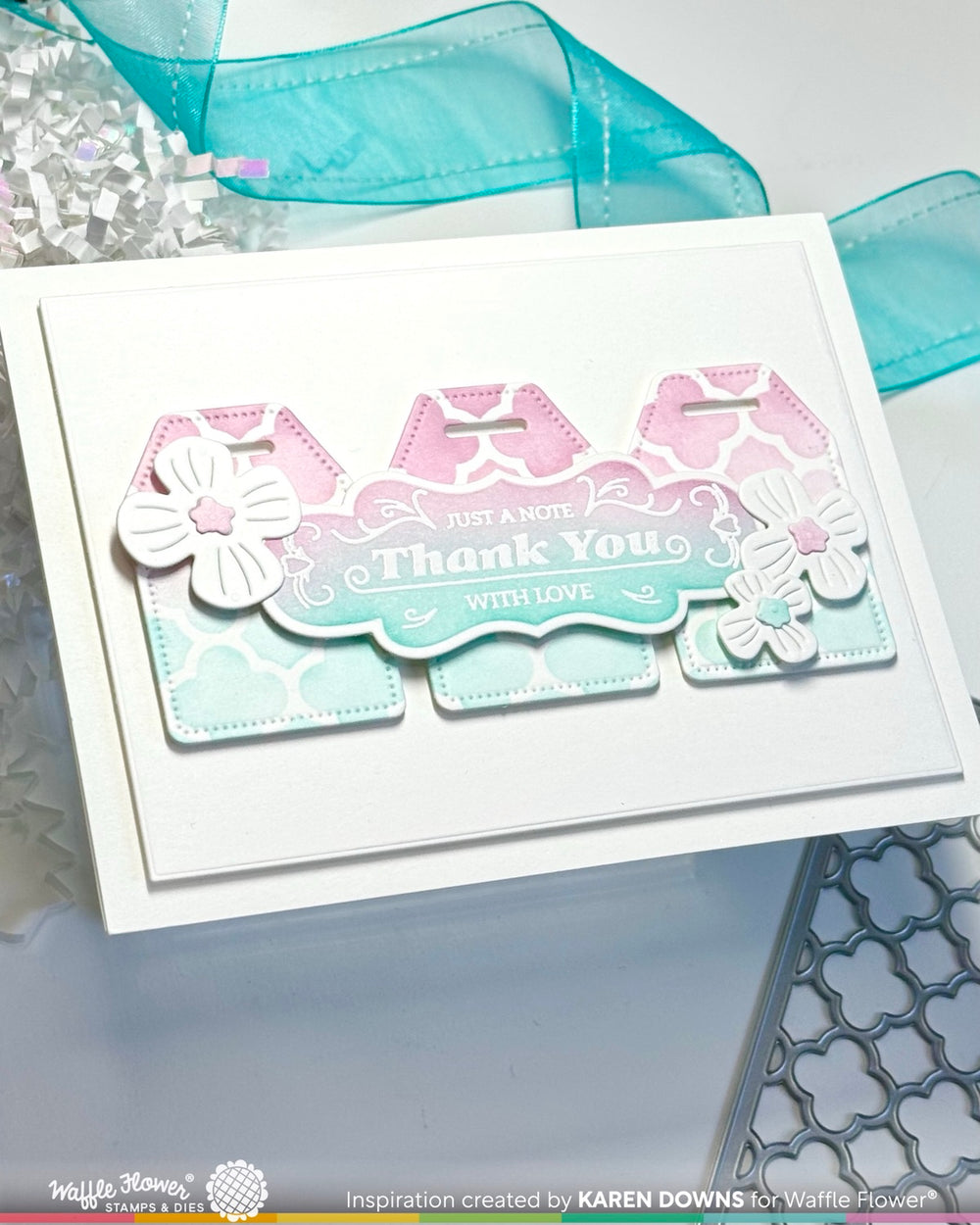 Decorative card with 'Thank You' text and floral designs on a white background.