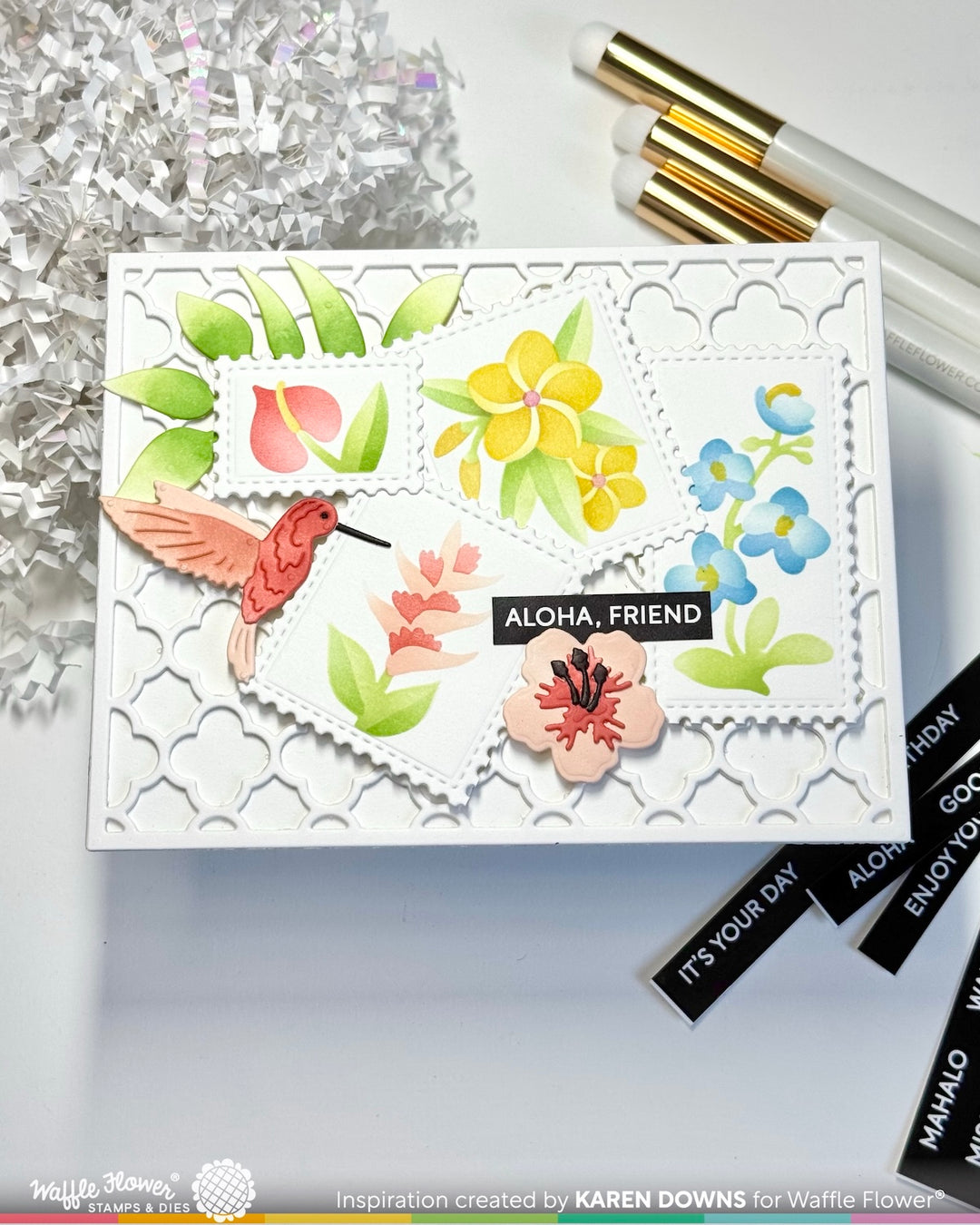 Decorative card with floral designs and 'Aloha, Friend' text on a white background.