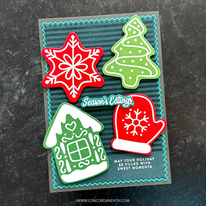 Concord & 9th Kristina Werner Gingerbread Cookies Stamps — a "Season's Eatings" card with colored gingerbread star, tree, house, and mitten shapes on a charcoal background.