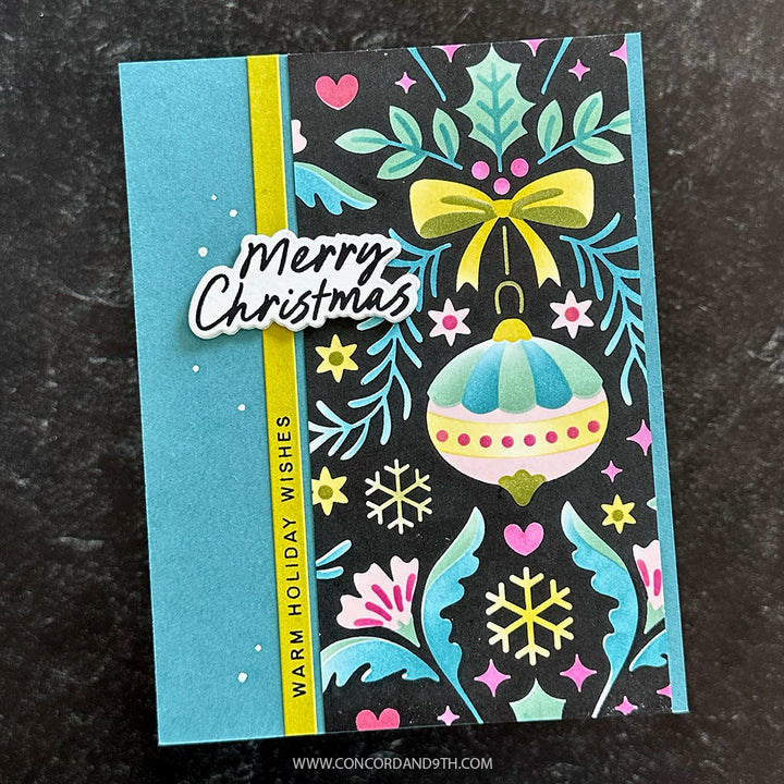 Concord & 9th Kristina Werner Holiday Cheer Greetings Stamps — a teal, pink, and black damask-patterned card with a stamped ornament and "Warm Holiday Wishes" sentiment.