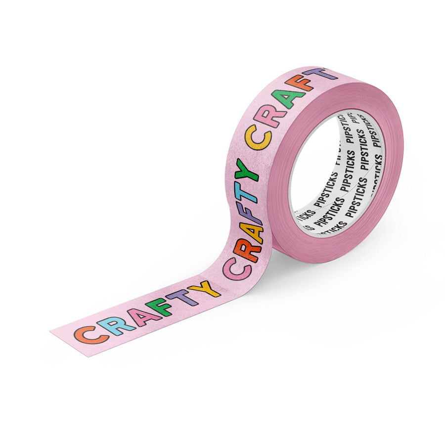 Pink tape with 'CRAFTY' text in colorful letters on a white background