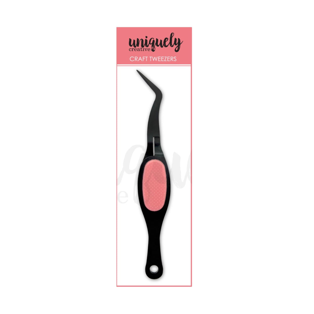 A single craft tweezzer with a black metal arm and a textured pink handle, shown in its retail packaging card. The packaging features a pink header with the brand name 'uniquely creative' and the text 'CRAFT TWEEZERS'.
